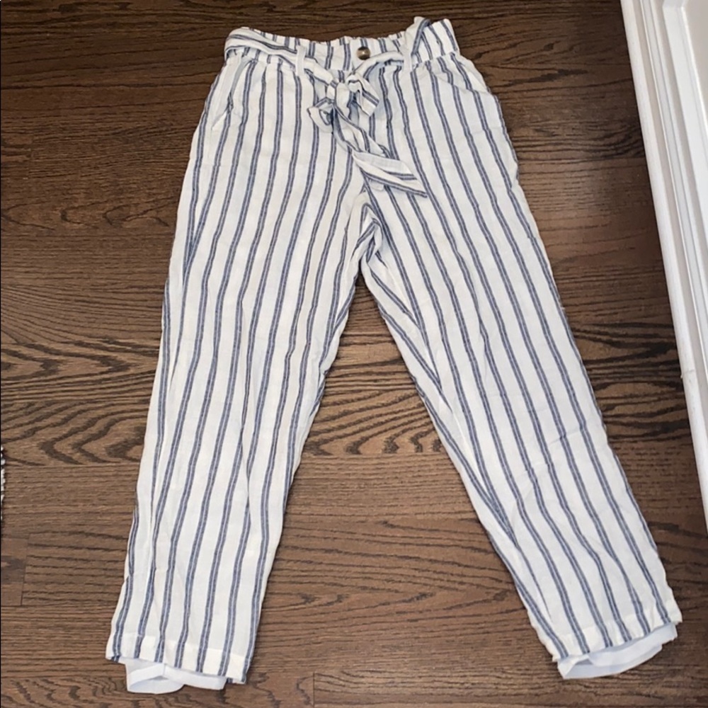 Gray and white stripped pants.